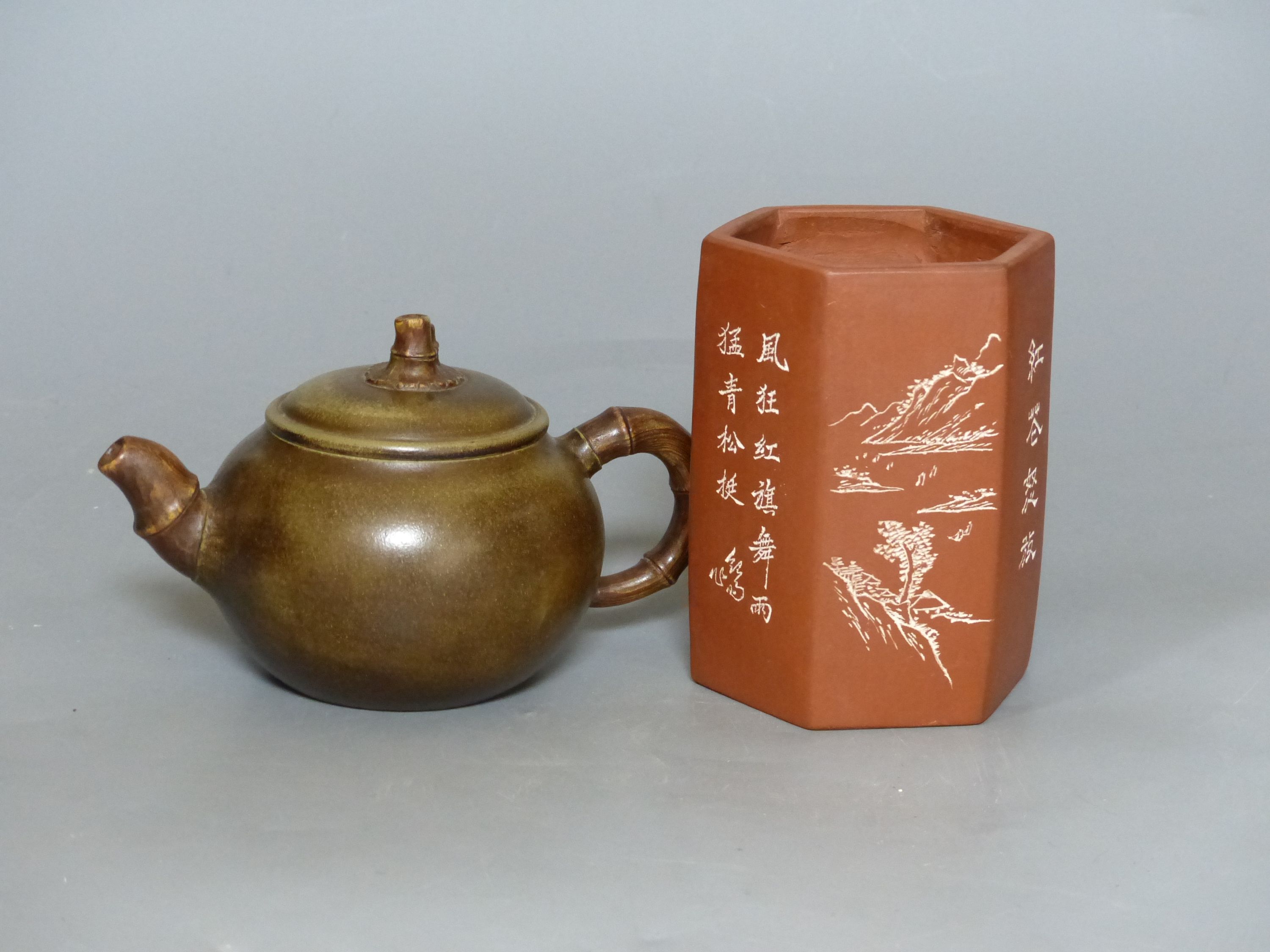 A Chinese Yixing teapot and brush pot with calligraphy and signatures, tallest 12cm